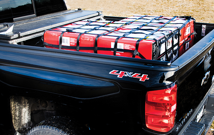 A cargo net used in the back of a pickup truck