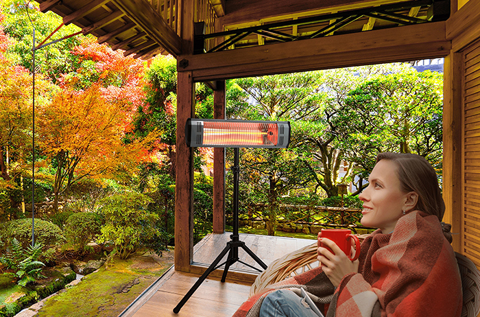 Using a portable heater to stay warm outdoors.