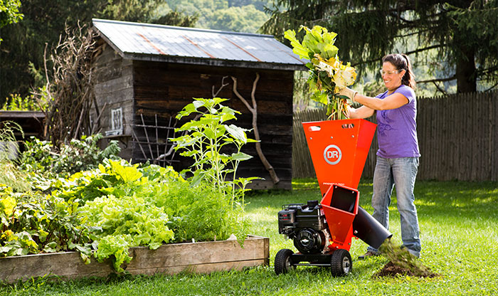 A woman uses a shredder