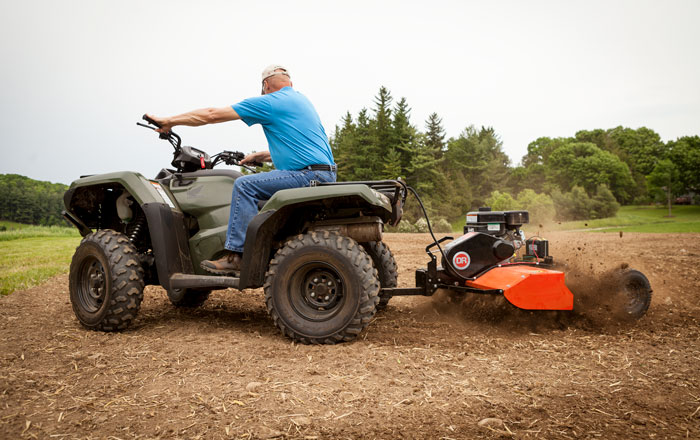 For large gardens or food plots go with a tow-behind tiller for ease of use.