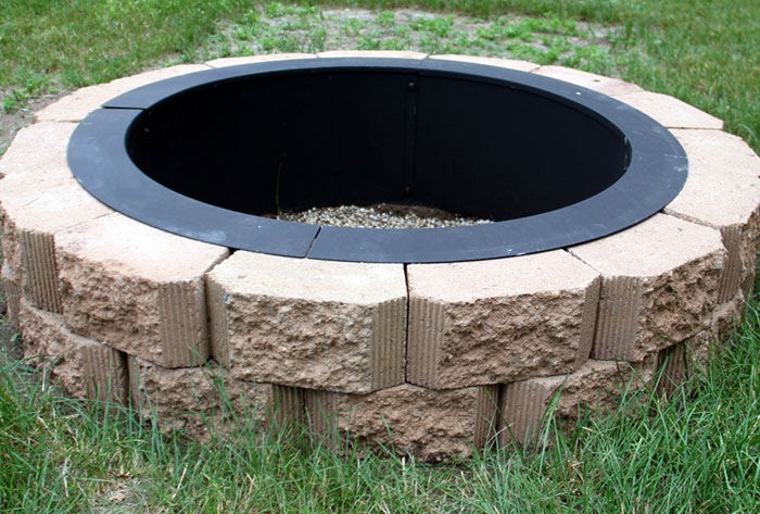 a fire ring surrounded by stones.