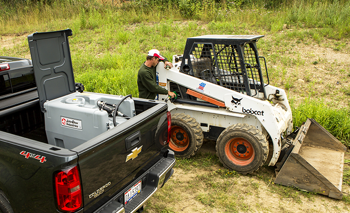 Using a fuel tank to refuel a vehicle.