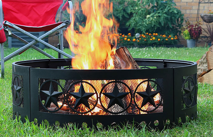 A fire pit on a stone patio.