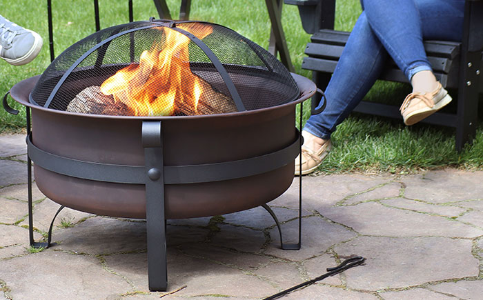 A fire pit on a stone patio.