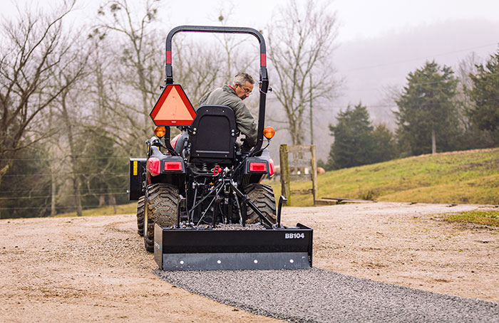 box blade at work on a driveway