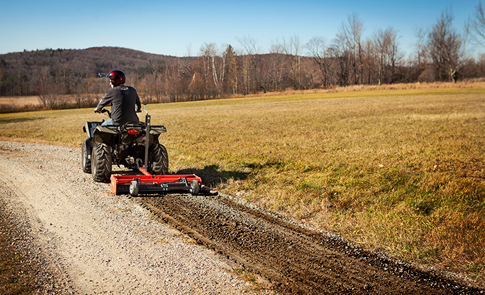 Power grader attached to ATV