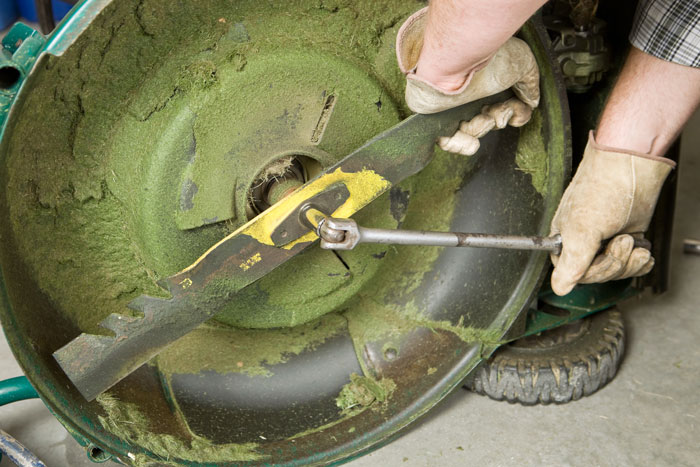 Removing the blade prior to sharpening.