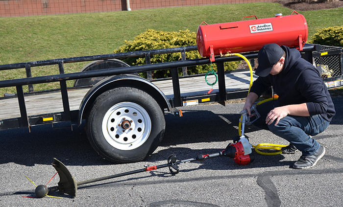 Using a fuel tank to fill a weed wacker