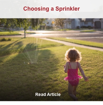 child running towards sprinkler