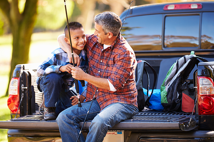 Father and son using a pickup