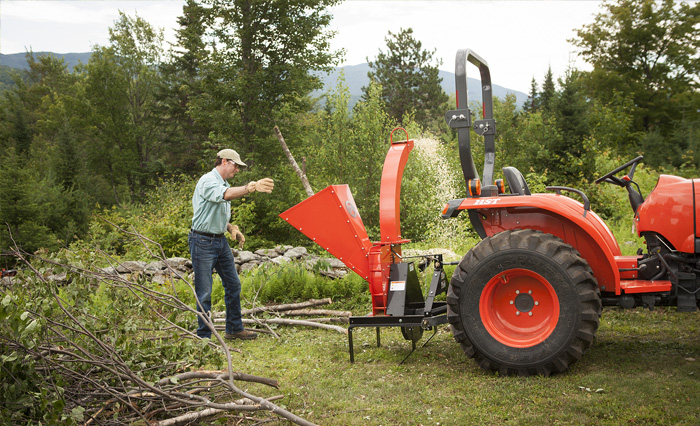 A person using chipper shredder