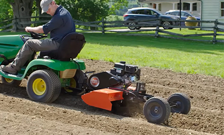 Riding lawn mower with rototiller online attachment