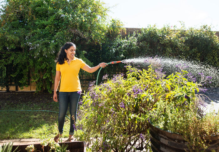 woman watering garden