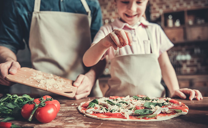 A family making pizza together